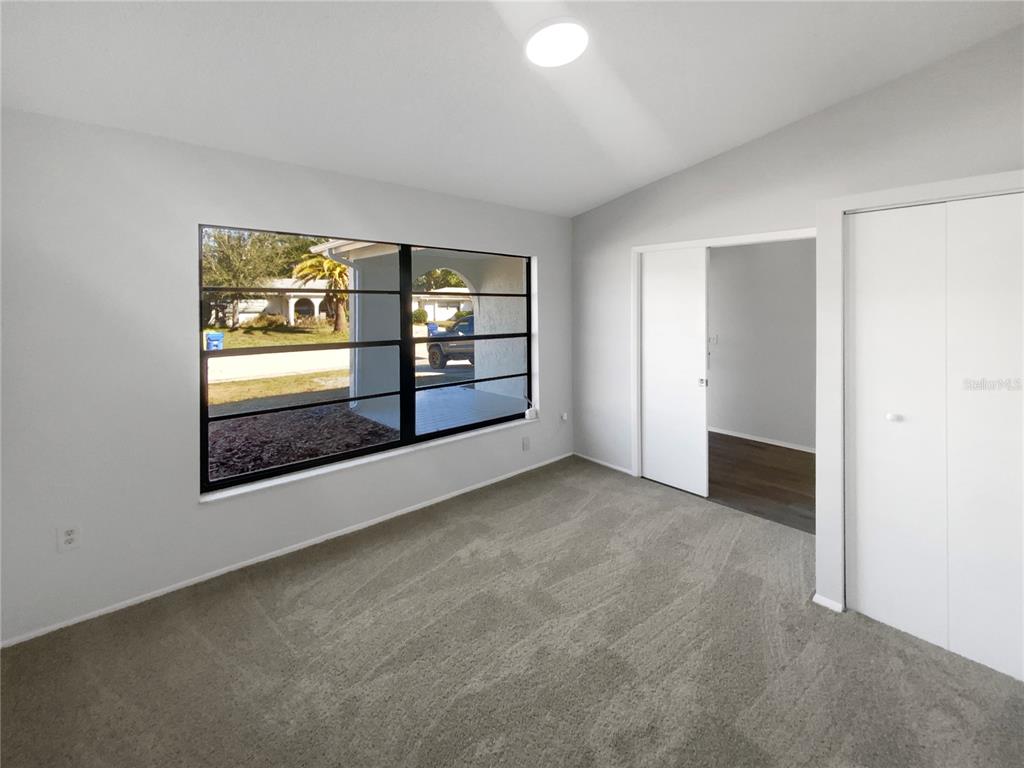 7846 Cayuga Drive New Port Richey, FL 34653 - Photo 19 of 32 an empty room with windows