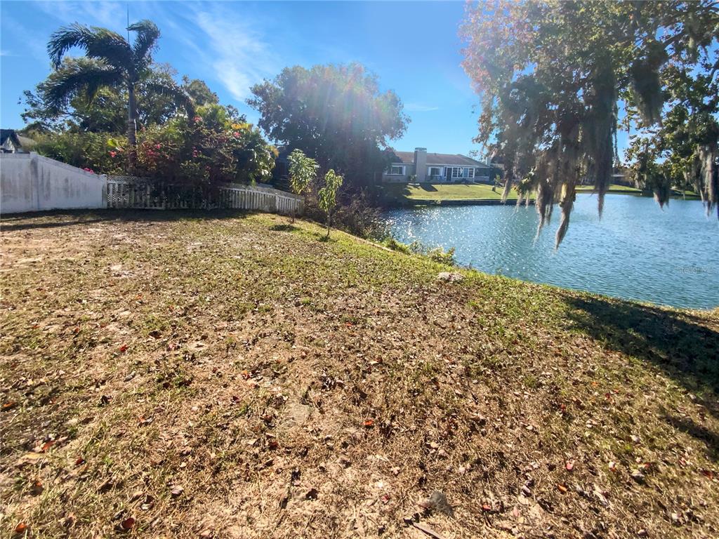 7846 Cayuga Drive New Port Richey, FL 34653 - Photo 5 of 32 a view of a lake with houses