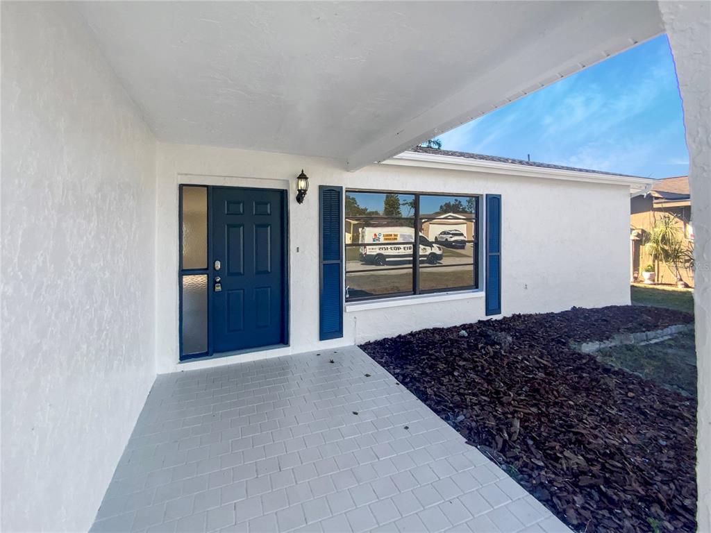 7846 Cayuga Drive New Port Richey, FL 34653 - Photo 7 of 32 a bedroom with bed and a window
