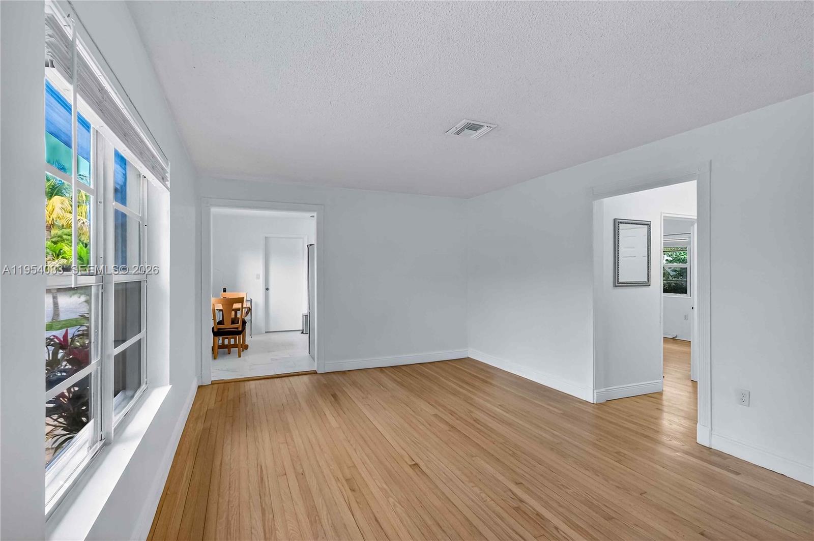 2399 Southwest 26th Lane Miami, FL 33133 - Photo 3 of 39 a view of livingroom with furniture and wooden floor