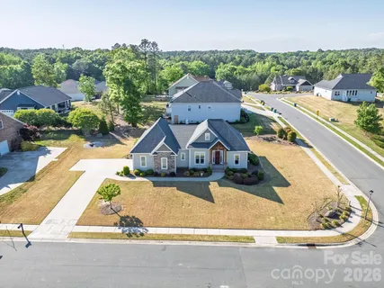 an aerial view of a house with swimming pool