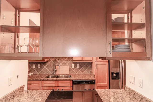 a view of wooden floor and a large window in a room