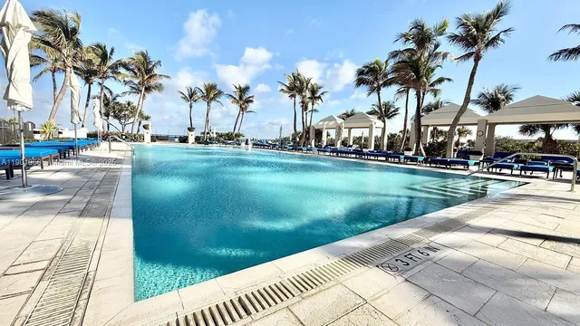 a view of a dining room with furniture and a rug
