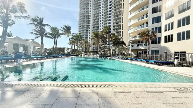 a kitchen with a stove and a refrigerator