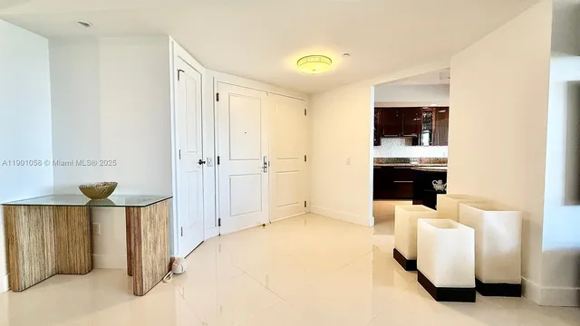 a living room with stainless steel appliances kitchen island granite countertop furniture and a view of kitchen
