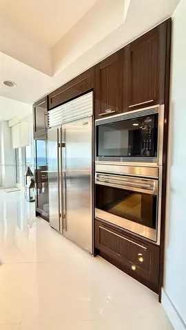 a large bathroom with a double vanity sink toilet mirror and bathtub