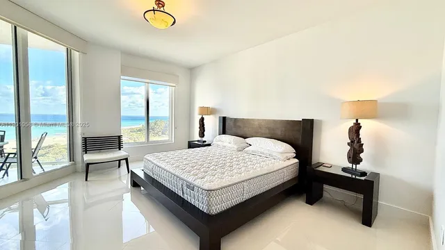 a bathroom with a sink a vanity and a large mirror