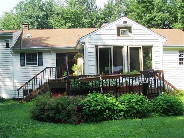 138 Pond Brook Road Huntington, MA 01050 - Photo 13 of 22 a front view of a house with a garden