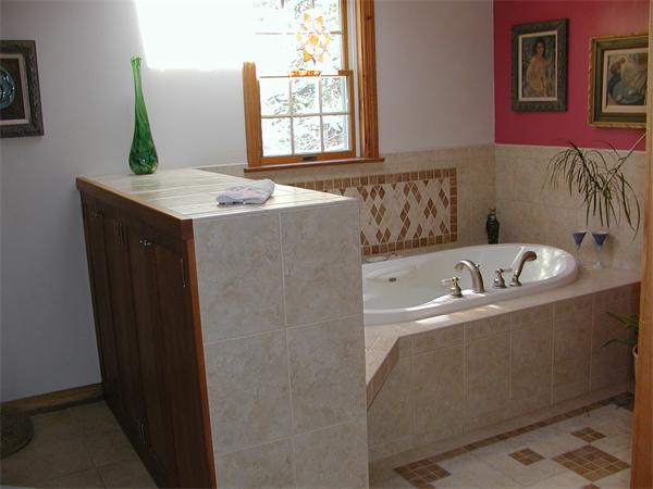 138 Pond Brook Road Huntington, MA 01050 - Photo 17 of 22 a bathroom with a granite countertop sink a window and a bathtub
