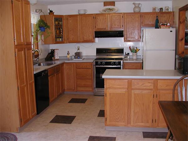 138 Pond Brook Road Huntington, MA 01050 - Photo 5 of 22 a kitchen with a refrigerator and a stove top oven
