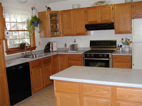 138 Pond Brook Road Huntington, MA 01050 - Photo 6 of 22 a kitchen with a sink a stove and cabinets