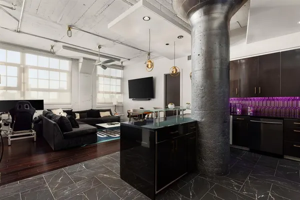 a living room with furniture and a flat screen tv