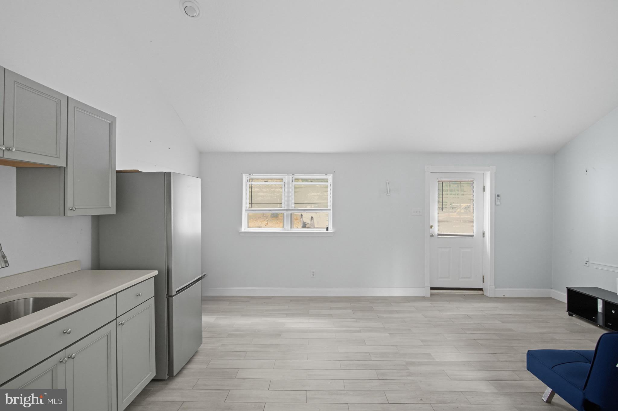 687 Jackson Road Atco, NJ 08004 - Photo 5 of 20 a kitchen with stainless steel appliances a refrigerator and a stove top oven