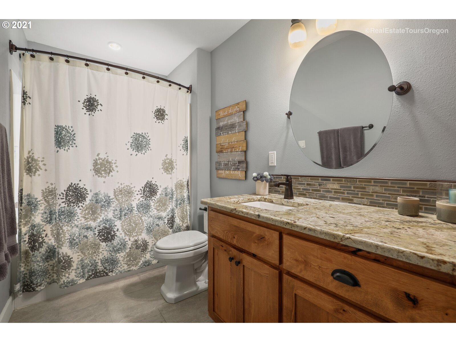 34321 Southeast Compton Road Boring, OR 97009 - Photo 17 of 32 a bathroom with a granite countertop sink a toilet and a mirror