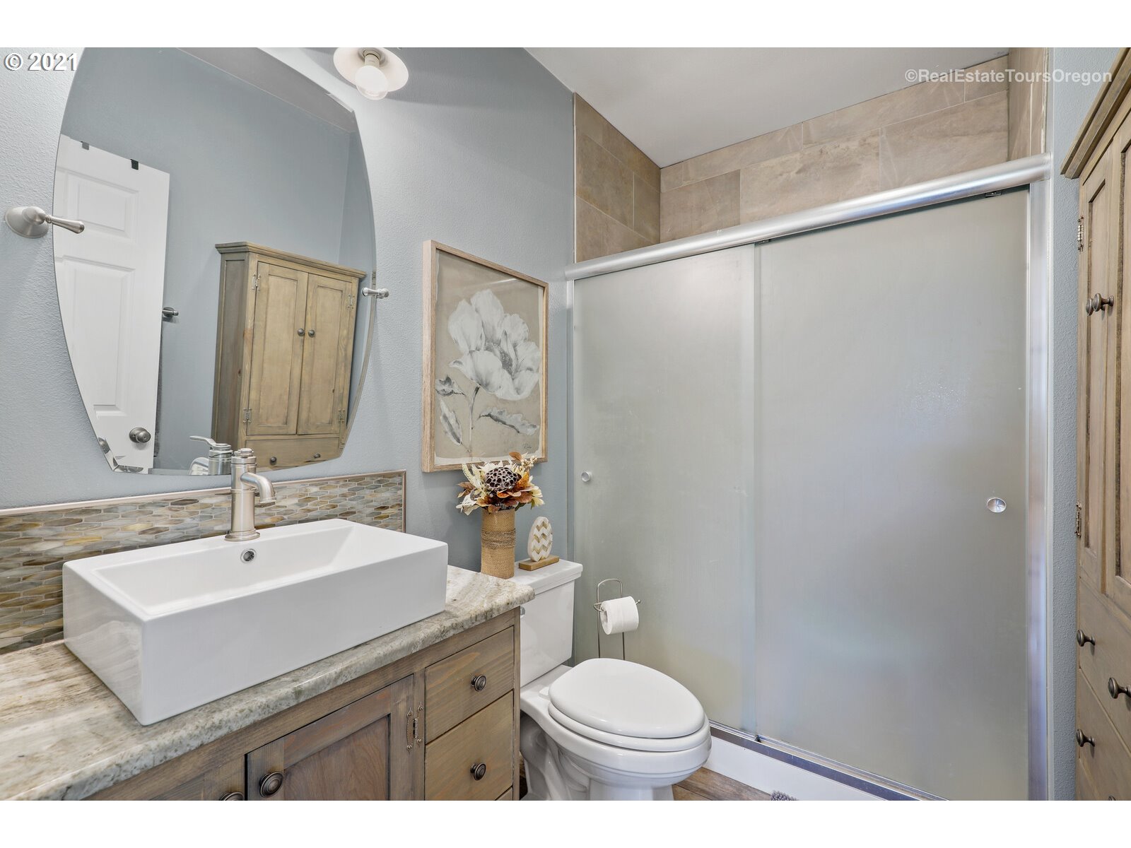 34321 Southeast Compton Road Boring, OR 97009 - Photo 26 of 32 a bathroom with a sink mirror vanity and toilet