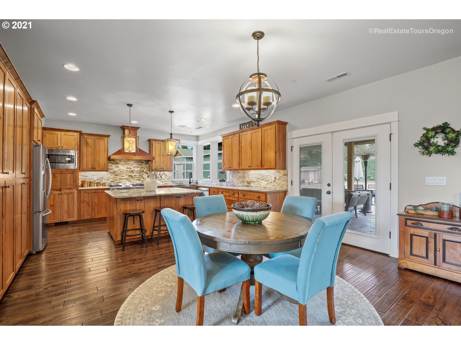 34321 Southeast Compton Road Boring, OR 97009 - Photo 5 of 32 a view of a dining room with furniture wooden floor and chandelier