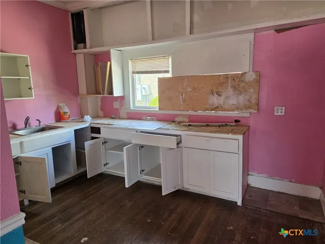a view of room with window and hardwood