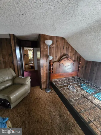 a living room with lots of furniture and a rug