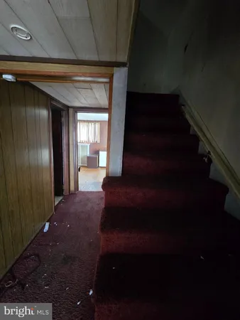 a view of an empty room and wooden floor