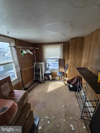 a bedroom with bed and window