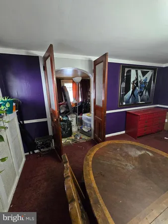 a view of a livingroom with furniture and a flat screen tv
