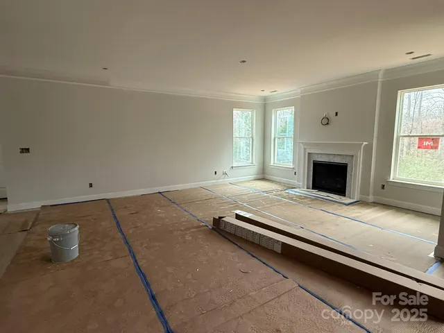 a room with a bed and a fireplace