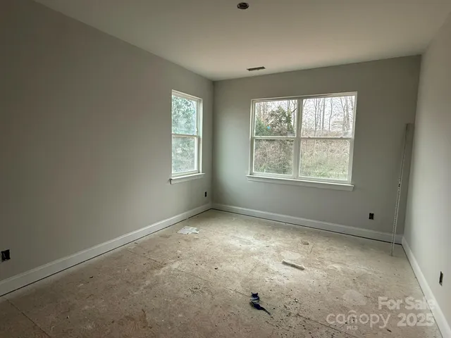 an empty room with windows