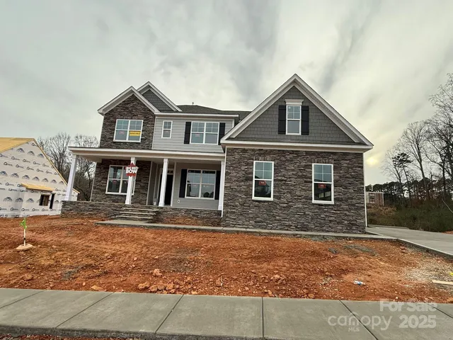 a front view of a house with yard
