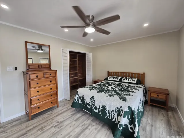 a bedroom with a bed and a dresser