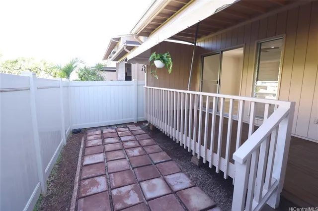 a view of a balcony with wooden floor