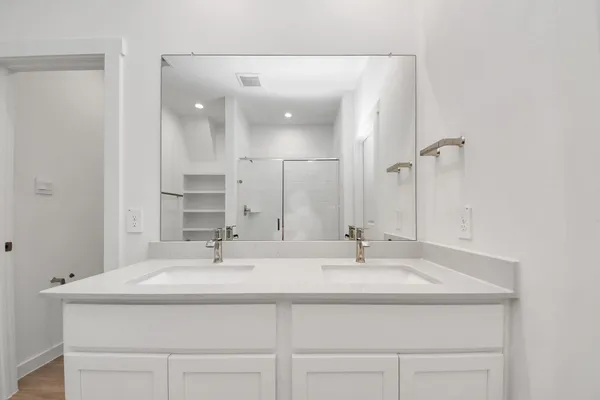 a view of a hallway with a white walls