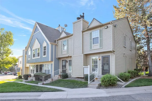 a front view of a building with a yard