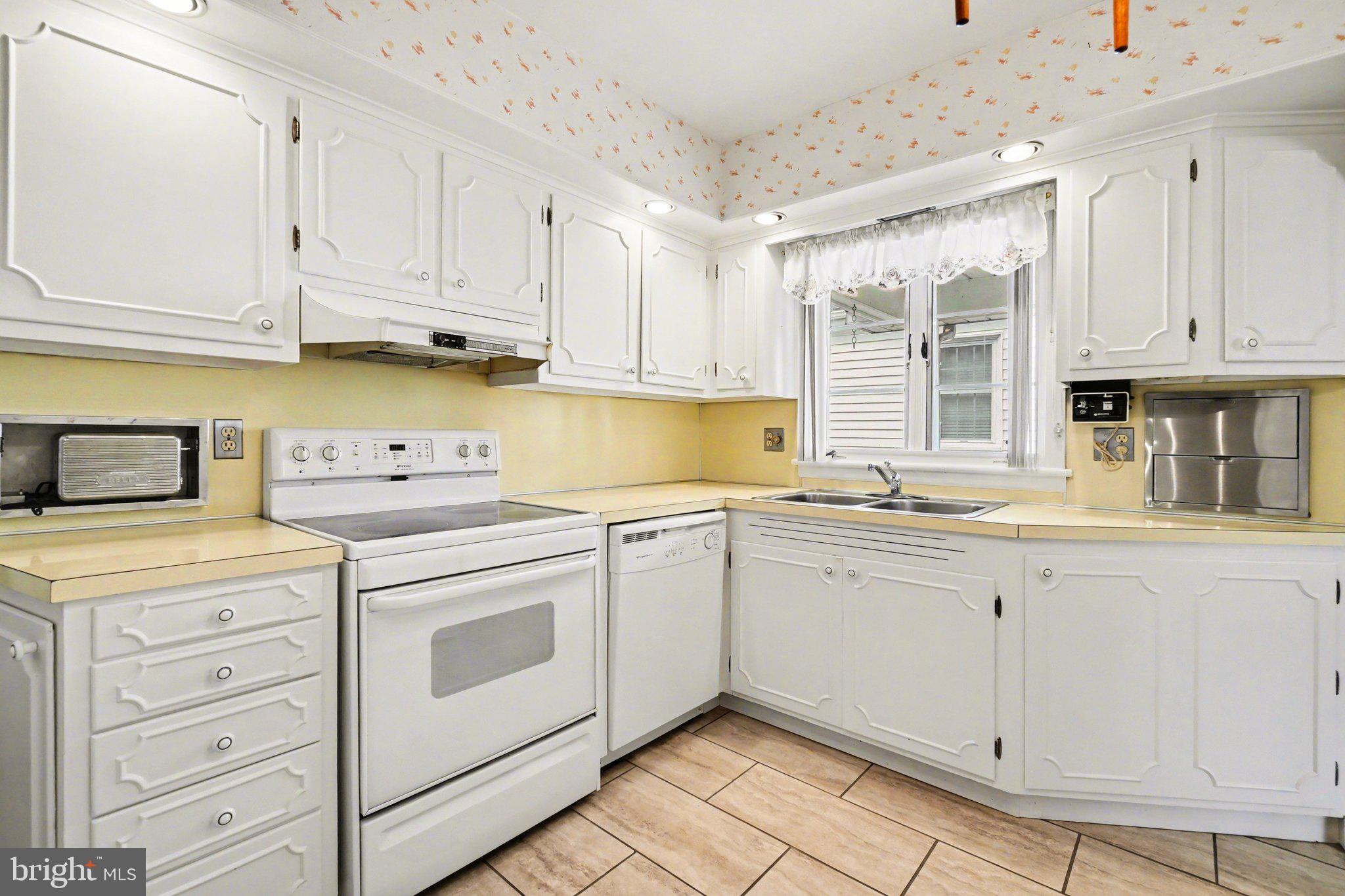 210 West Chestnut Street Cleona, PA 17042 - Photo 14 of 35 a kitchen with granite countertop white cabinets and white appliances