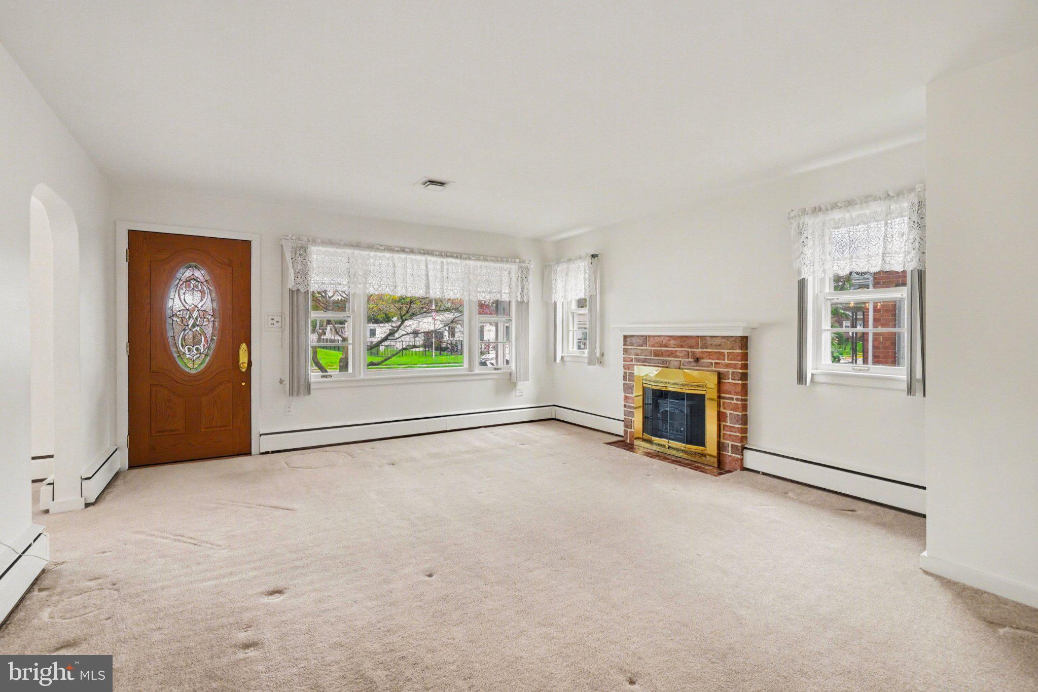 210 West Chestnut Street Cleona, PA 17042 - Photo 9 of 35 an empty room with windows fire place and fireplace