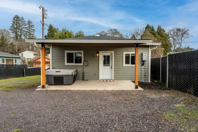 a view of a house with a backyard
