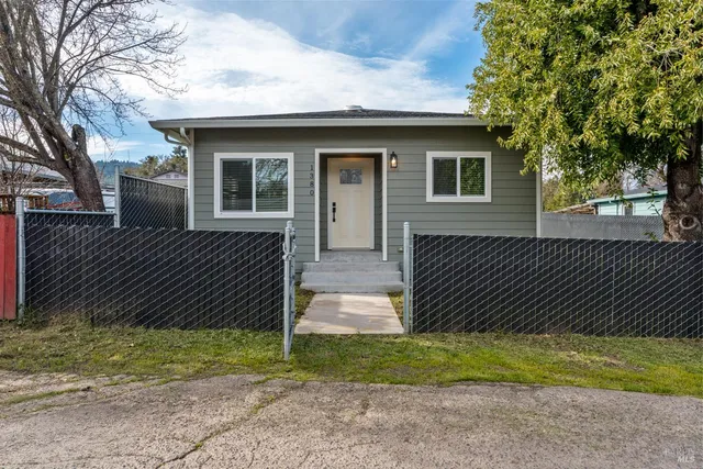a front view of a house with a yard