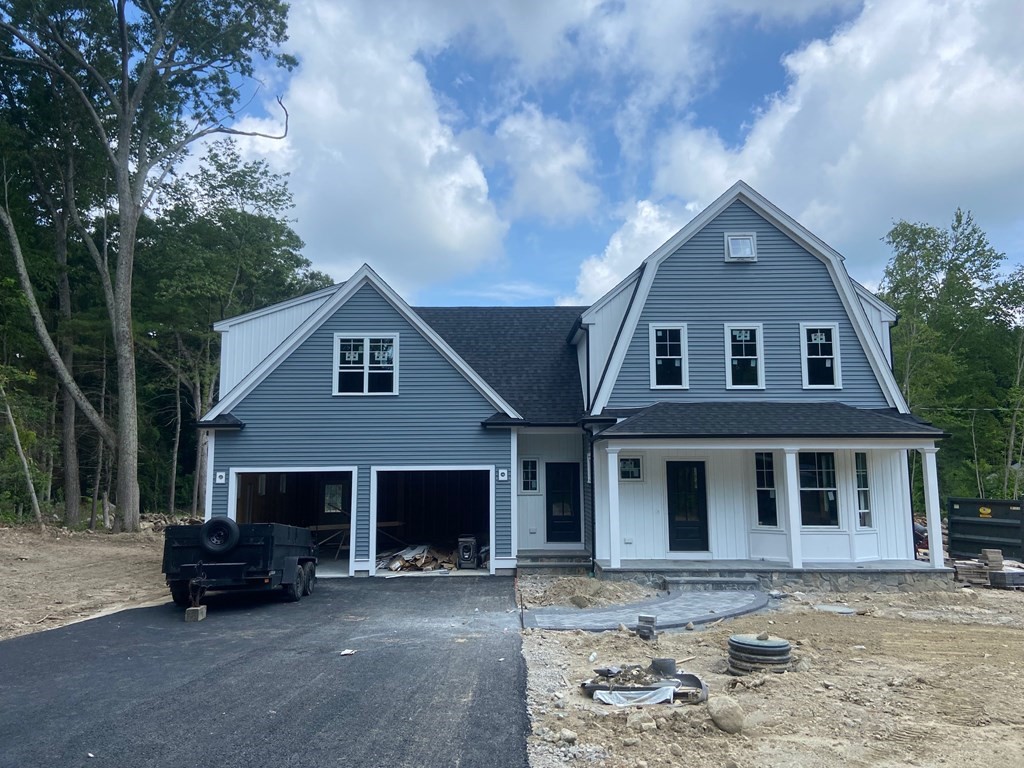 70 Birchwood Road Holliston, MA 01746 - Photo 2 of 7 a front view of a house with a yard