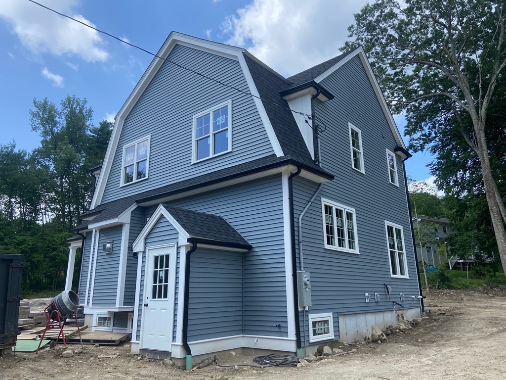70 Birchwood Road Holliston, MA 01746 - Photo 5 of 7 a front view of a house with a yard