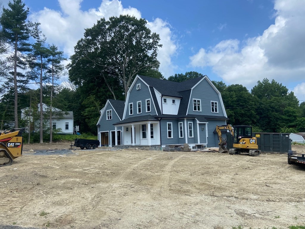 70 Birchwood Road Holliston, MA 01746 - Photo 6 of 7 a front view of a house with cars parked