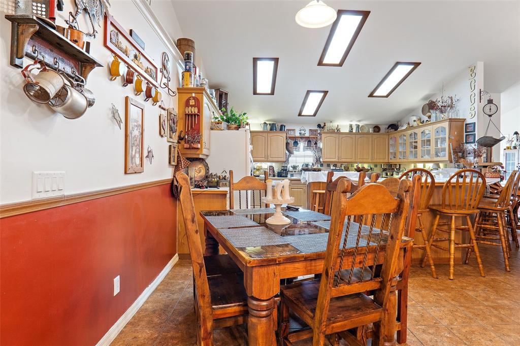 19355 Southwest 25th Place Dunnellon, FL 34431 - Photo 11 of 38 a dining room with lots of furniture and chandelier