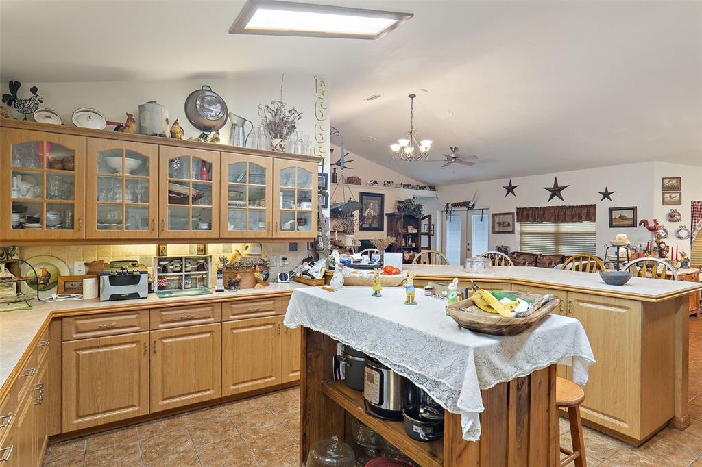 19355 Southwest 25th Place Dunnellon, FL 34431 - Photo 14 of 38 a kitchen with a sink stove and cabinets