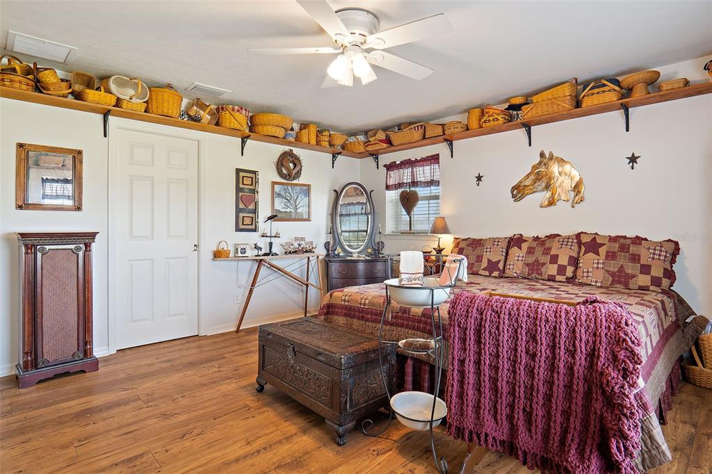 19355 Southwest 25th Place Dunnellon, FL 34431 - Photo 15 of 38 a bedroom with furniture and wooden floor