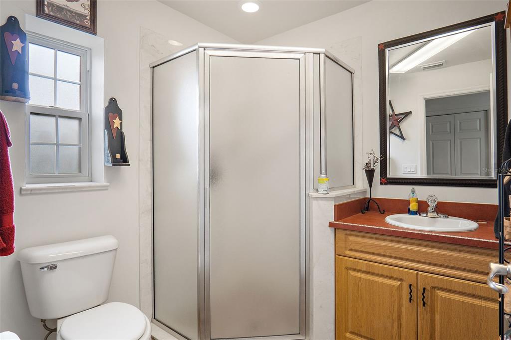 19355 Southwest 25th Place Dunnellon, FL 34431 - Photo 16 of 38 a bathroom with a sink toilet and mirror