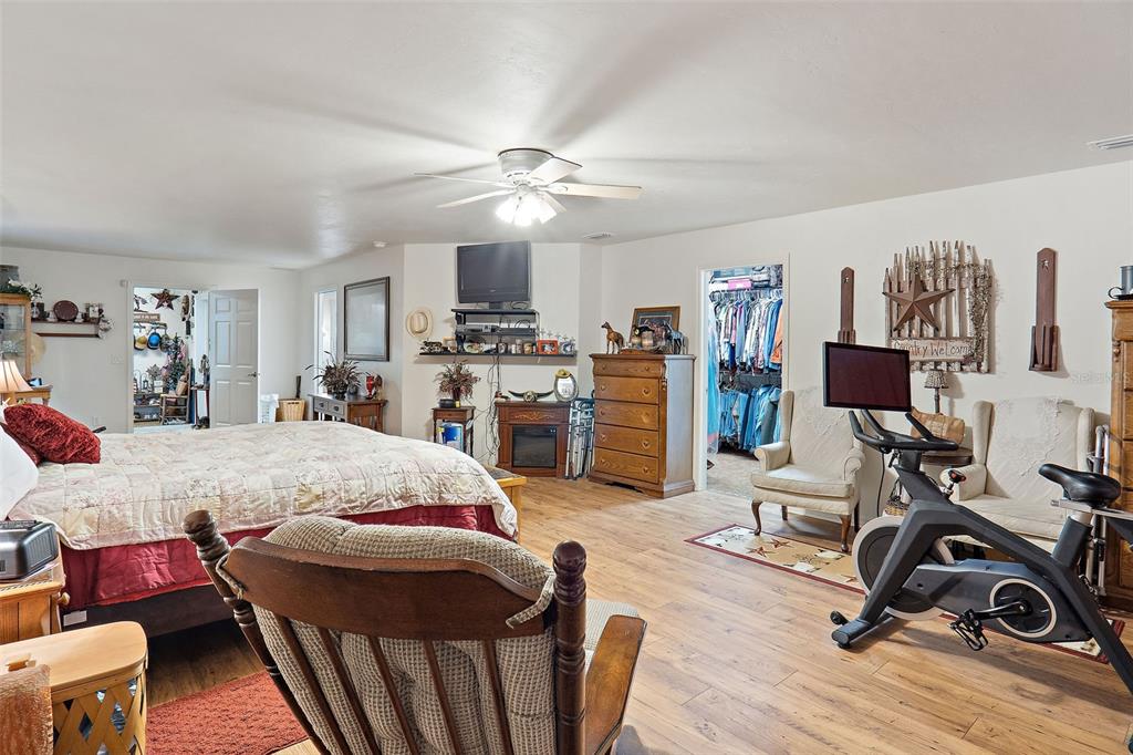 19355 Southwest 25th Place Dunnellon, FL 34431 - Photo 22 of 38 a bed room with furniture and a flat screen tv