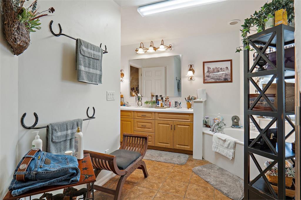 19355 Southwest 25th Place Dunnellon, FL 34431 - Photo 24 of 38 a room with a chair and cabinets