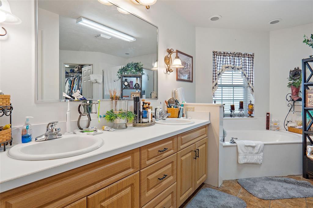 19355 Southwest 25th Place Dunnellon, FL 34431 - Photo 25 of 38 a bathroom with a granite countertop sink mirror and window