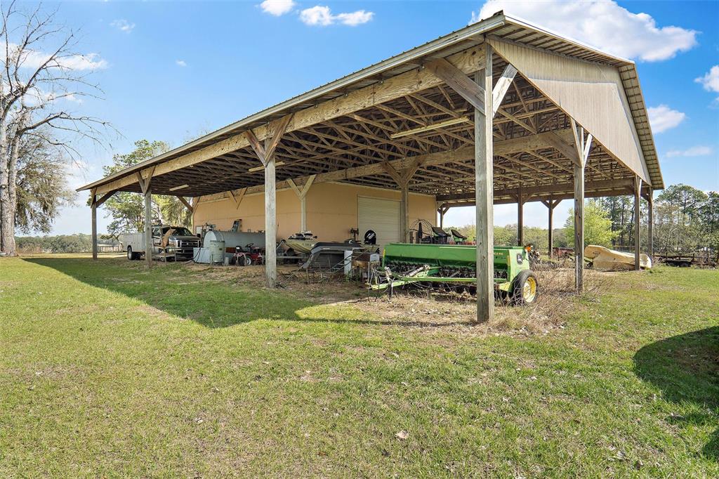 19355 Southwest 25th Place Dunnellon, FL 34431 - Photo 33 of 38 a view of a house with backyard and sitting area