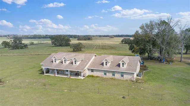 a view of a patio with table and chairs