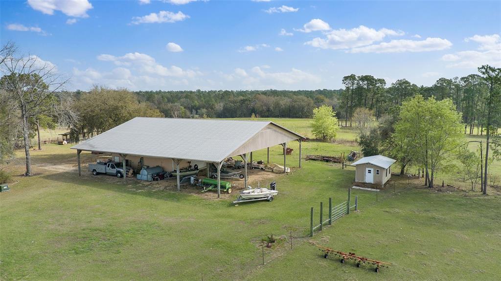 19355 Southwest 25th Place Dunnellon, FL 34431 - Photo 36 of 38 a aerial view of a house with swimming pool table and chairs