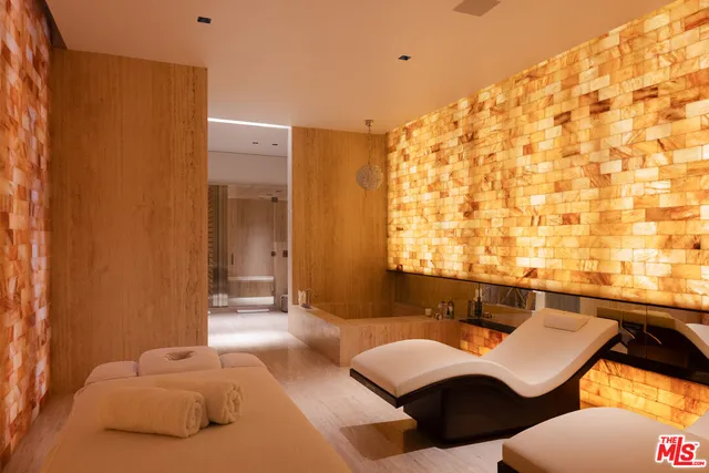 a living room with furniture and a lamp